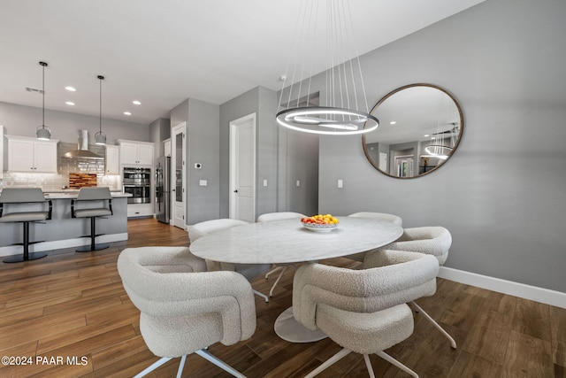 dining space with recessed lighting, baseboards, visible vents, and dark wood finished floors