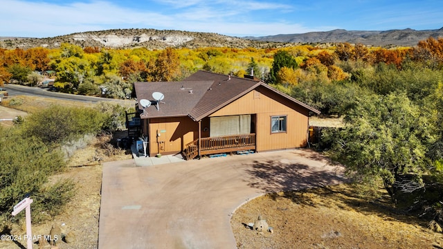 view of front of home featuring a deck with mountain view