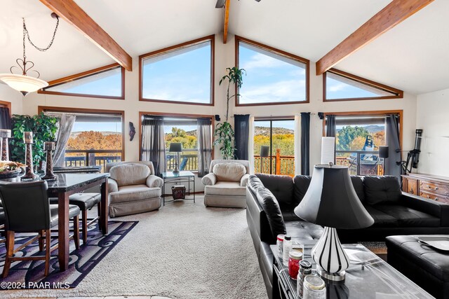 living room featuring carpet, beamed ceiling, and high vaulted ceiling