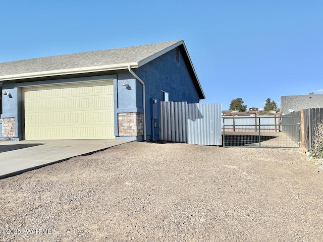 view of property exterior featuring a garage