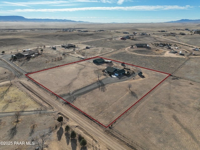 birds eye view of property with a mountain view