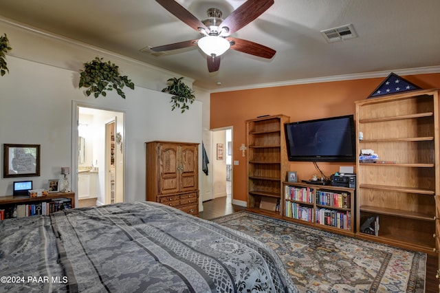 bedroom with wood-type flooring, connected bathroom, ceiling fan, and ornamental molding