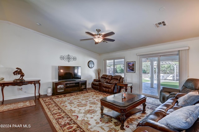 living room with hardwood / wood-style floors, ceiling fan, lofted ceiling, and crown molding