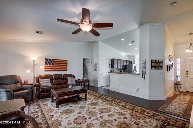 living room featuring ceiling fan, crown molding, dark hardwood / wood-style floors, and lofted ceiling