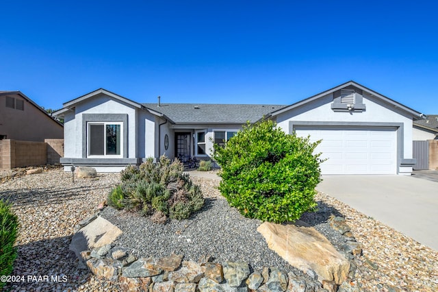 ranch-style home with a garage