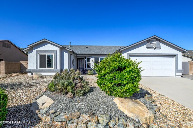 ranch-style home with a garage