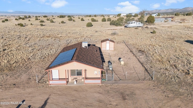 birds eye view of property featuring a mountain view