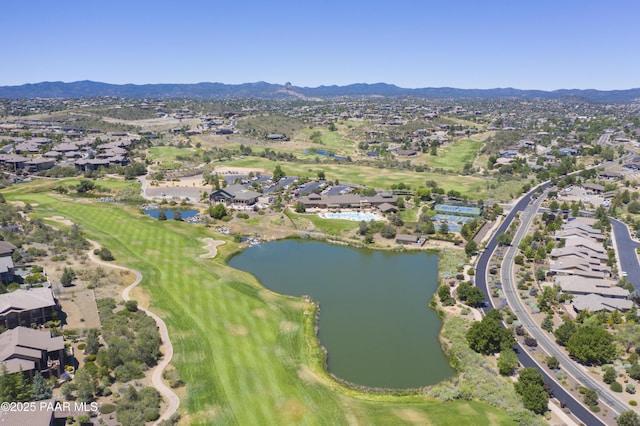 drone / aerial view featuring a water and mountain view