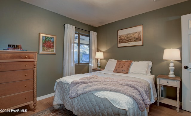 bedroom with light hardwood / wood-style flooring