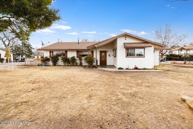 single story home with fence