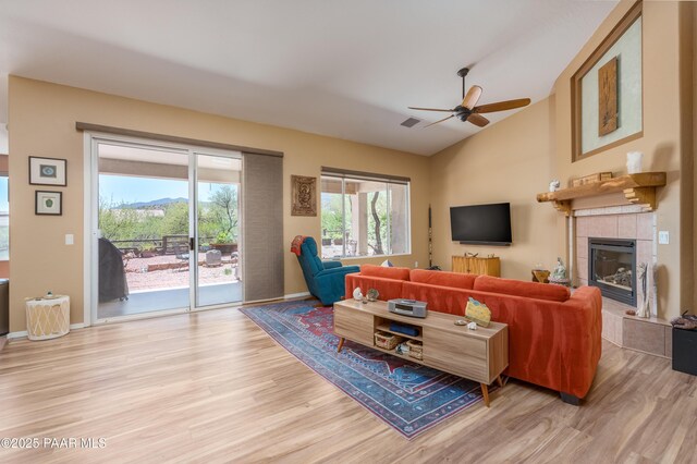 2315 W Desert Willow Dr, Cottonwood, AZ 86326 - living area featuring ceiling fan, a fireplace, light wood-style flooring, and lofted ceiling