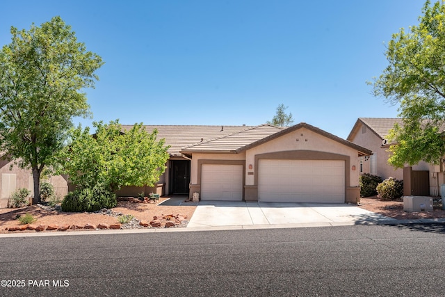 2315 W Desert Willow Dr, Cottonwood, AZ 86326 - ranch-style house with a garage, stucco siding, driveway, and a tile roof