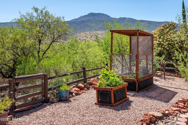 2315 W Desert Willow Dr, Cottonwood, AZ 86326 - view of yard with a garden, a mountain view, and fence