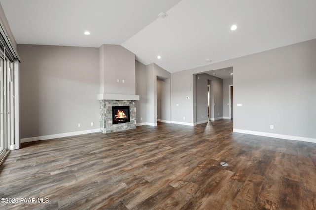 5385 Rocky Vista Dr, Prescott, AZ 86301 - unfurnished living room with vaulted ceiling, dark wood-style flooring, a fireplace, and recessed lighting