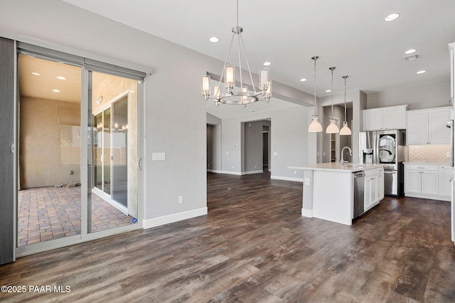 5385 Rocky Vista Dr, Prescott, AZ 86301 - kitchen with appliances with stainless steel finishes, recessed lighting, a chandelier, open floor plan, and light countertops