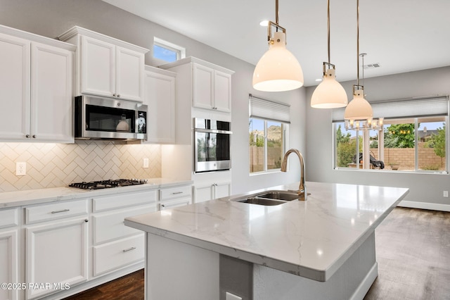 5385 Rocky Vista Dr, Prescott, AZ 86301 - kitchen featuring stainless steel appliances, tasteful backsplash, white cabinets, dark wood-type flooring, and healthy amount of natural light