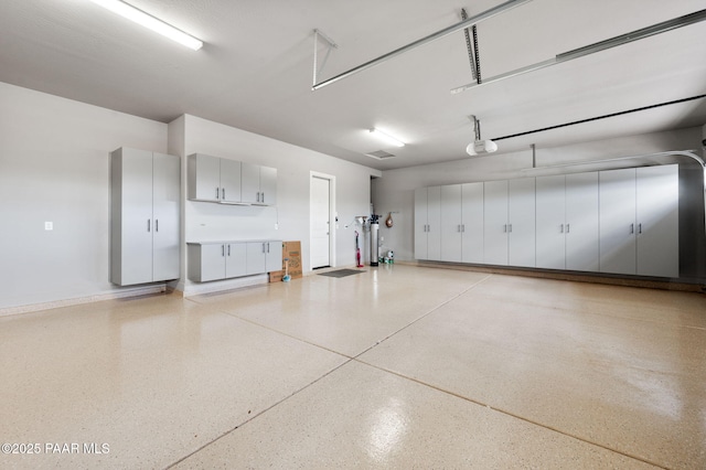 5385 Rocky Vista Dr, Prescott, AZ 86301 - garage with a garage door opener and baseboards