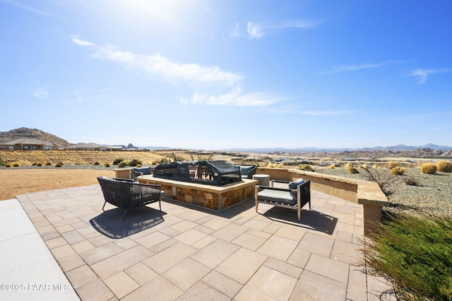 5385 Rocky Vista Dr, Prescott, AZ 86301 - view of patio featuring a mountain view and an outdoor living space with a fire pit