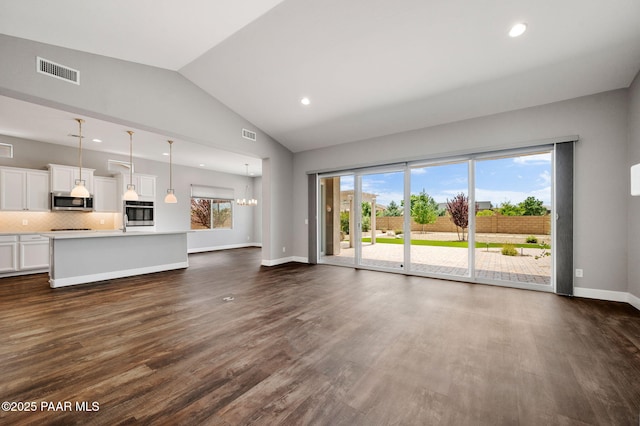 5385 Rocky Vista Dr, Prescott, AZ 86301 - unfurnished living room featuring lofted ceiling, dark wood-style floors, and recessed lighting