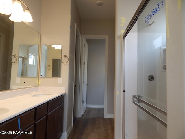 bathroom featuring vanity and hardwood / wood-style floors