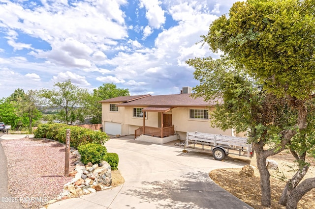 2345 Shinnery Ln, Prescott, AZ 86301 - ranch-style home featuring stucco siding, an attached garage, concrete driveway, and a shingled roof
