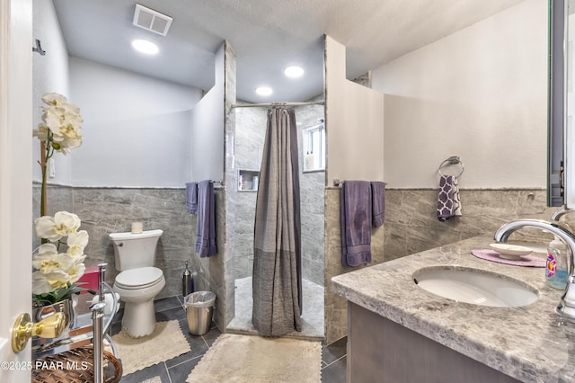 2345 Shinnery Ln, Prescott, AZ 86301 - bathroom with tile walls, tile patterned flooring, vanity, wainscoting, and curtained shower
