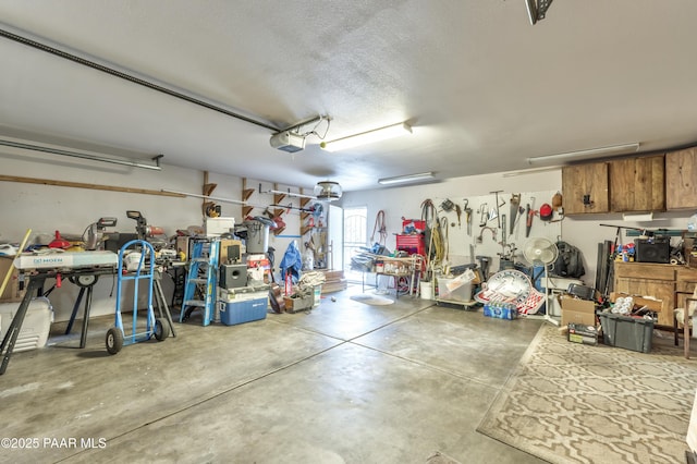 2345 Shinnery Ln, Prescott, AZ 86301 - garage featuring a garage door opener and a workshop area