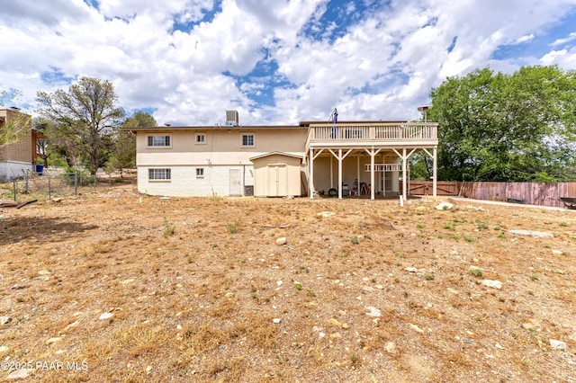 2345 Shinnery Ln, Prescott, AZ 86301 - back of house with a storage shed, a deck, and stucco siding