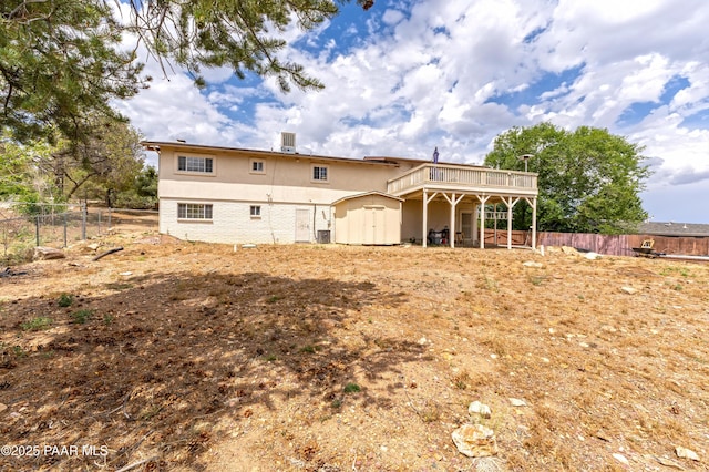 2345 Shinnery Ln, Prescott, AZ 86301 - back of property with a storage unit, stucco siding, and a deck