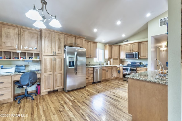 2345 Shinnery Ln, Prescott, AZ 86301 - kitchen with appliances with stainless steel finishes, light brown cabinetry, light stone counters, light wood-type flooring, and lofted ceiling