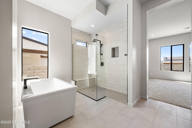 bathroom with visible vents, recessed lighting, a walk in shower, tile patterned flooring, and baseboards