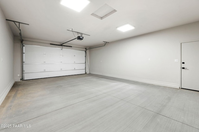 garage featuring baseboards and a garage door opener