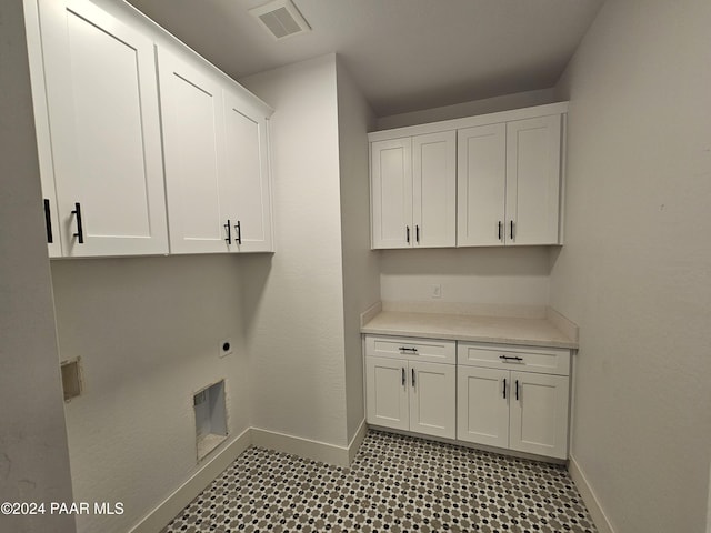 laundry room with cabinets and hookup for an electric dryer