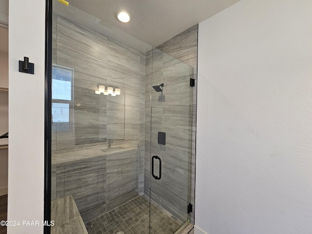 bathroom featuring an enclosed shower