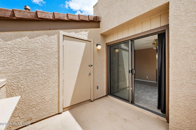 2180 Resort Way Unit S B, Prescott, AZ 86305 - view of exterior entry featuring stucco siding and a patio