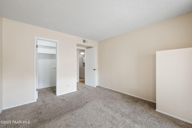 2180 Resort Way Unit S B, Prescott, AZ 86305 - unfurnished bedroom featuring carpet, a spacious closet, a textured ceiling, baseboards, and a closet