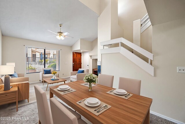 2180 Resort Way Unit S B, Prescott, AZ 86305 - carpeted dining space featuring baseboards, ceiling fan, and high vaulted ceiling
