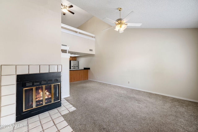 2180 Resort Way Unit S B, Prescott, AZ 86305 - unfurnished living room with ceiling fan, a fireplace with flush hearth, light carpet, high vaulted ceiling, and baseboards