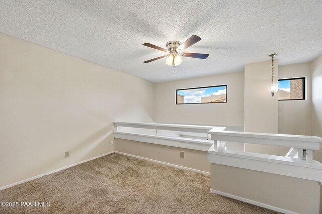 2180 Resort Way Unit S B, Prescott, AZ 86305 - spare room featuring a ceiling fan, carpet floors, baseboards, and a textured ceiling