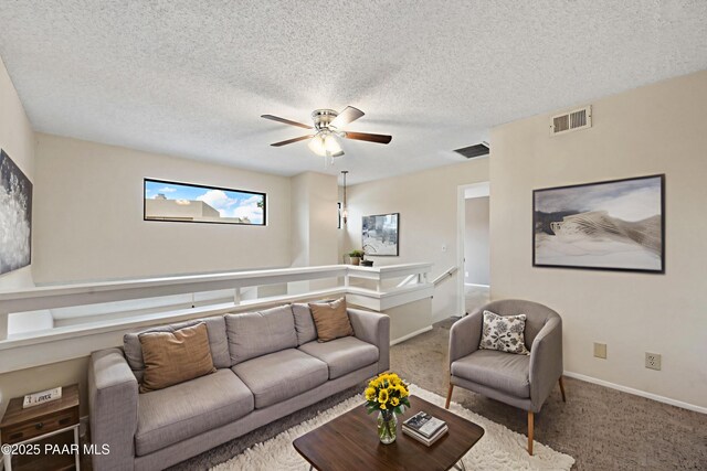 2180 Resort Way Unit S B, Prescott, AZ 86305 - carpeted living area featuring a ceiling fan, a textured ceiling, and baseboards
