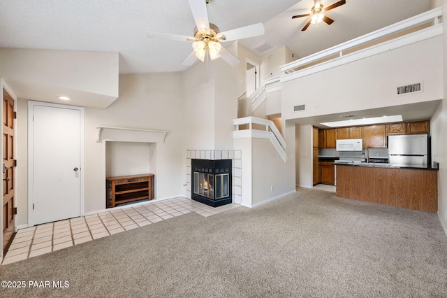 2180 Resort Way Unit S B, Prescott, AZ 86305 - unfurnished living room with ceiling fan, light carpet, baseboards, and high vaulted ceiling