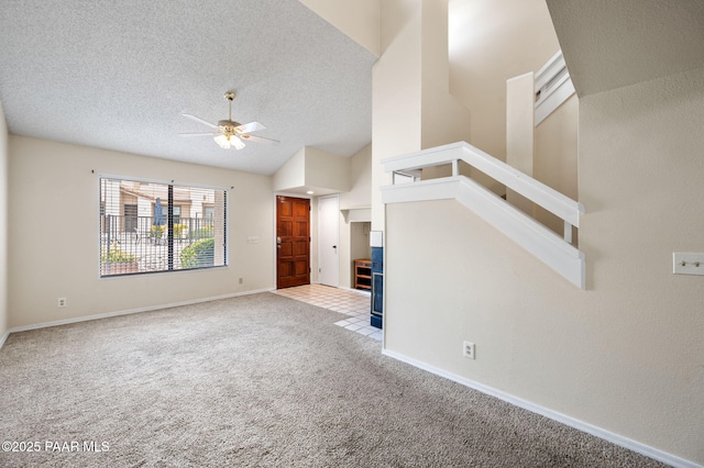 2180 Resort Way Unit S B, Prescott, AZ 86305 - unfurnished living room featuring carpet, a ceiling fan, a textured ceiling, baseboards, and lofted ceiling