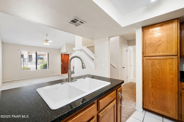 2180 Resort Way Unit S B, Prescott, AZ 86305 - kitchen featuring a sink, light colored carpet, dark countertops, baseboards, and ceiling fan