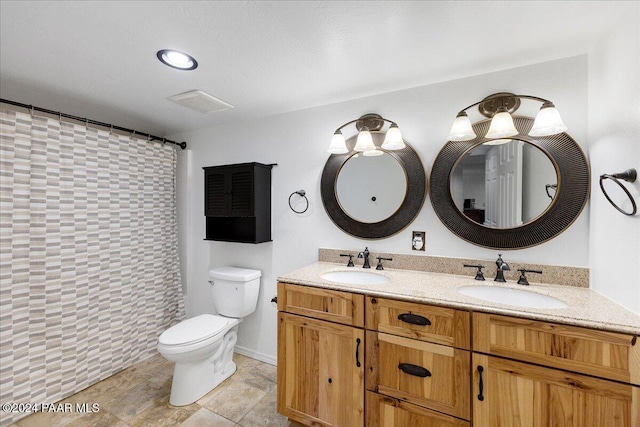 bathroom with a shower with shower curtain, vanity, and toilet