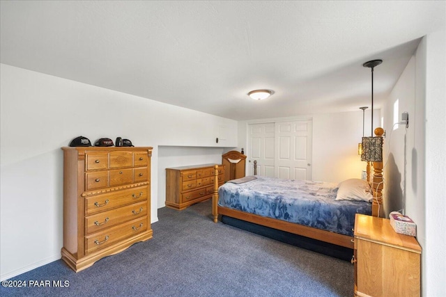 carpeted bedroom with a closet