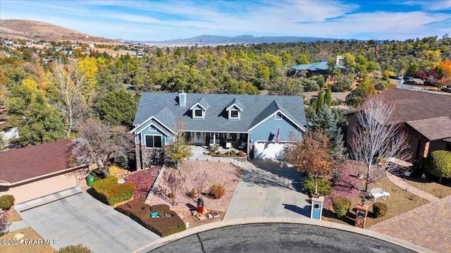 birds eye view of property with a mountain view