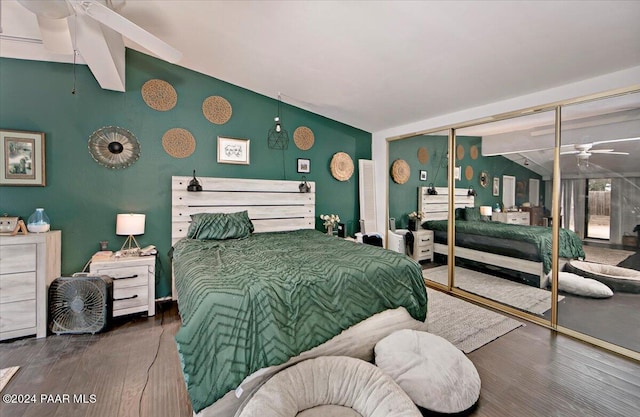 bedroom with wood-type flooring, lofted ceiling with beams, and a closet