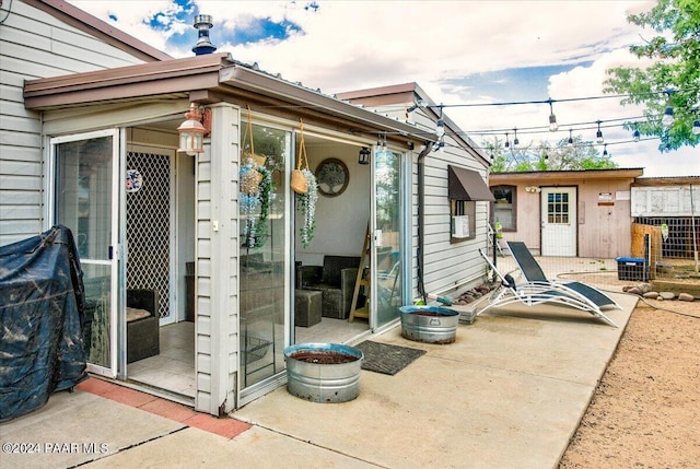 view of patio with an outbuilding