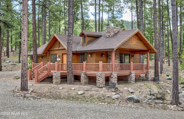 log-style house featuring a porch