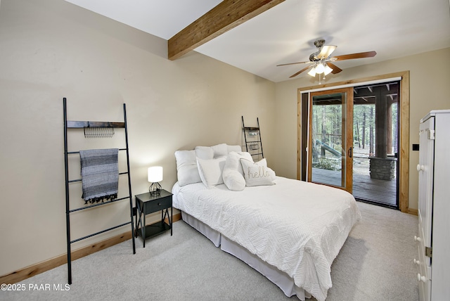 bedroom featuring ceiling fan, light colored carpet, access to outside, beam ceiling, and french doors